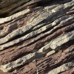 Detailed view of layered rock formations showing natural geological patterns and textures.